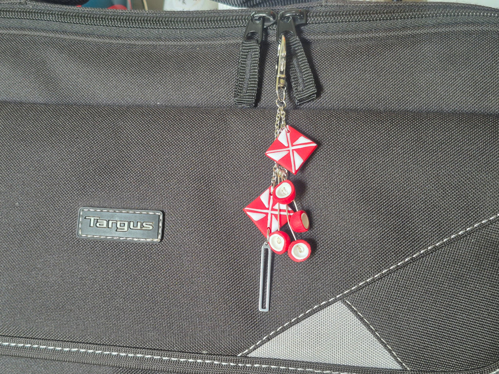 Red star charm keychain with pink round beads and metal lobster clasp