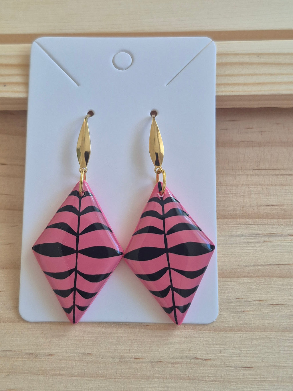 Pink and black geometric triangular drop earrings with gold-tone hooks