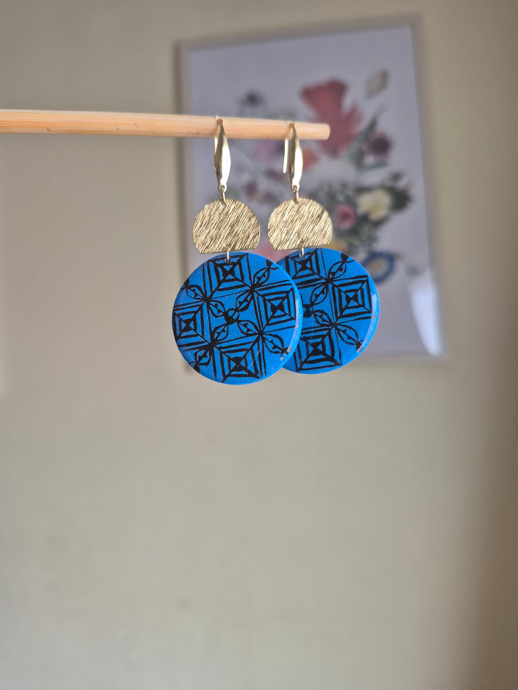 Blue and tan geometric disc earrings with gold hooks, layered round design