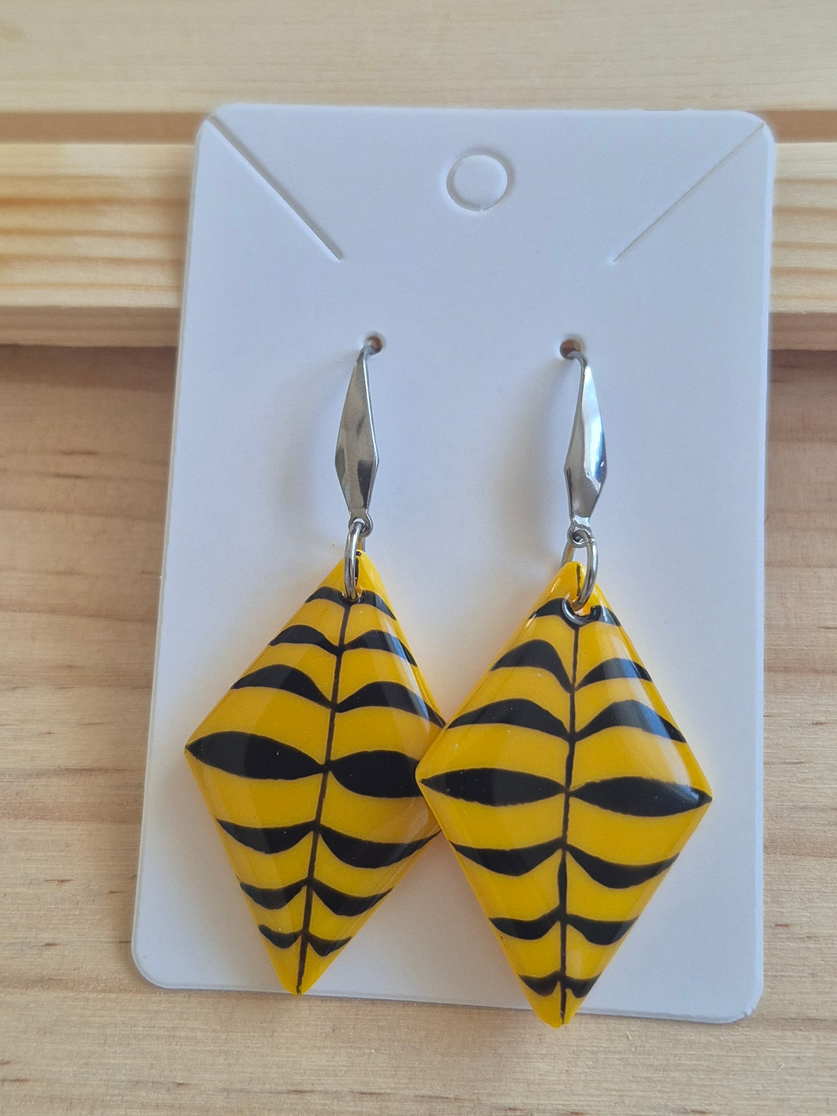 Yellow and navy geometric triangular drop earrings with silver hook backs
