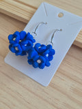 Blue fabric flower dangle earrings with silver-tone hooks