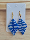 Blue and white patterned diamond drop earrings on gold hooks
