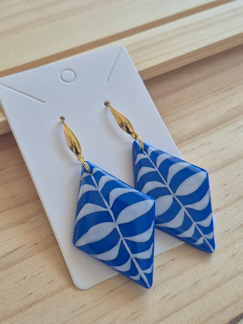 Blue and white geometric drop earrings on gold hooks