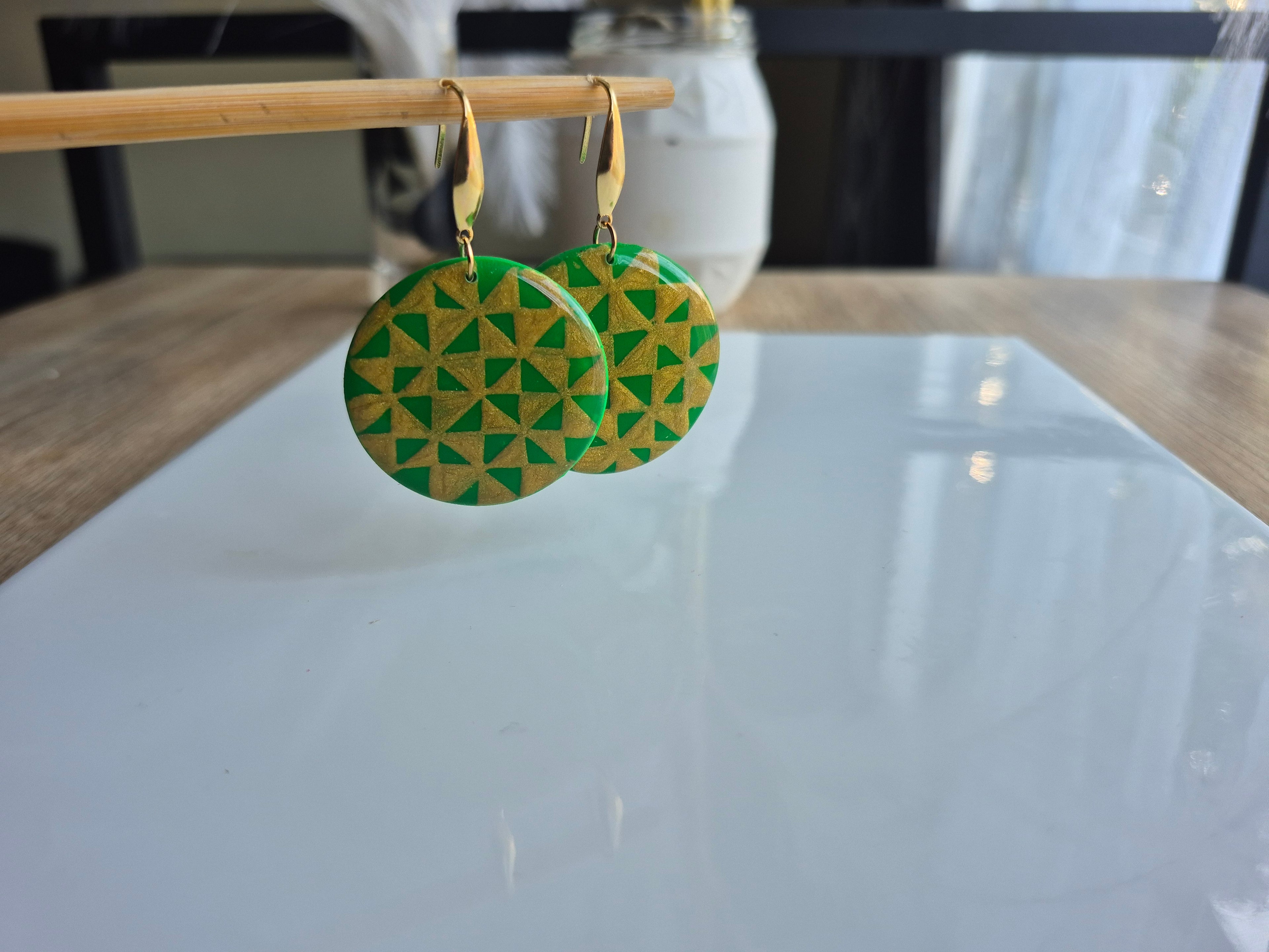 Manulua circle earrings, green geometric pattern with gold-tone lever hooks.